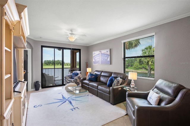 6515 Grand Estuary Trl Unit 208, Bradenton, FL 34212 - living room with healthy amount of natural light, ornamental molding, a ceiling fan, and light tile patterned flooring