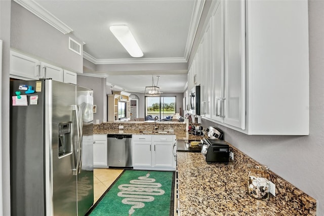 6515 Grand Estuary Trl Unit 208, Bradenton, FL 34212 - kitchen with appliances with stainless steel finishes, white cabinets, ornamental molding, stone countertops, and a sink