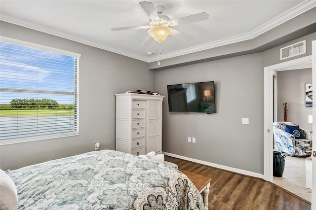 6515 Grand Estuary Trl Unit 208, Bradenton, FL 34212 - bedroom with crown molding, dark wood-style floors, baseboards, and ceiling fan