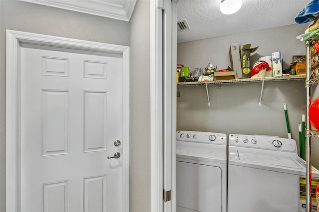 6515 Grand Estuary Trl Unit 208, Bradenton, FL 34212 - washroom featuring washing machine and dryer and a textured ceiling