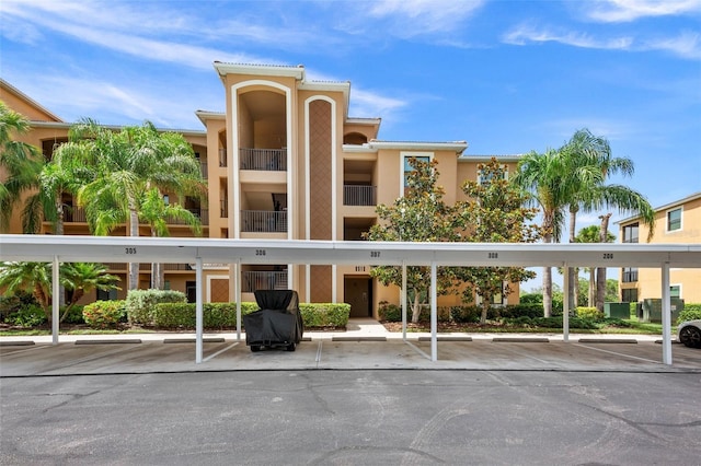 6515 Grand Estuary Trl Unit 208, Bradenton, FL 34212 - view of property featuring covered parking