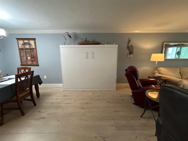 3272 Lake Bayshore Dr Unit 515, Bradenton, FL 34205 - living room with crown molding, light wood-style floors, and baseboards