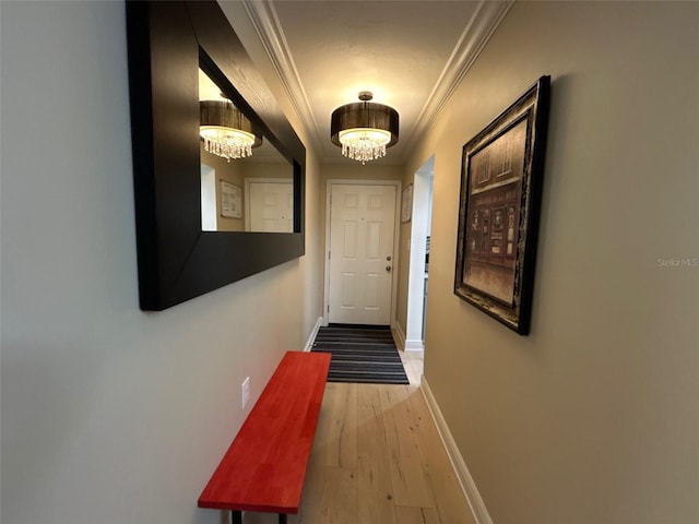 3272 Lake Bayshore Dr Unit 515, Bradenton, FL 34205 - doorway to outside featuring a chandelier, ornamental molding, light wood-style floors, and baseboards