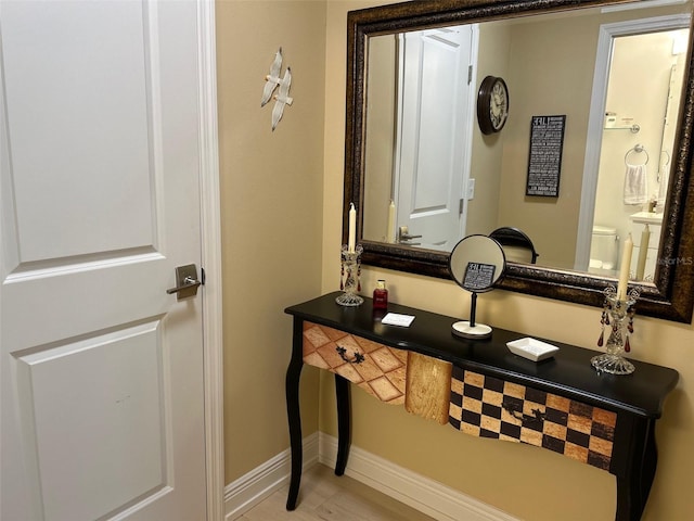 3272 Lake Bayshore Dr Unit 515, Bradenton, FL 34205 - bathroom featuring baseboards and toilet