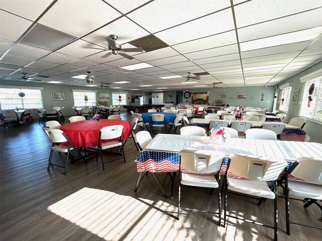 3272 Lake Bayshore Dr Unit 515, Bradenton, FL 34205 - dining space with a ceiling fan, wood finished floors, a drop ceiling, and plenty of natural light