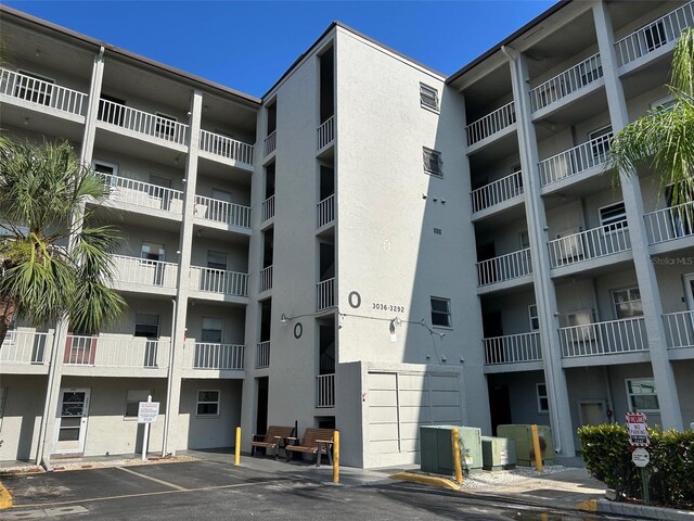 3272 Lake Bayshore Dr Unit 515, Bradenton, FL 34205 - view of apartment building / complex featuring uncovered parking