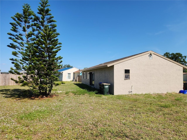 6405 Myrtlewood Rd, North Port, FL 34287 - rear view of house featuring stucco siding