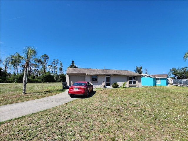 6405 Myrtlewood Rd, North Port, FL 34287 - single story home with an attached garage, a front lawn, concrete driveway, and stucco siding