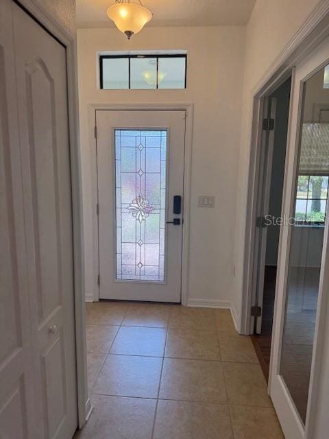 4077 River Bank Way, Punta Gorda, FL 33980 - foyer entrance with baseboards and light tile patterned flooring