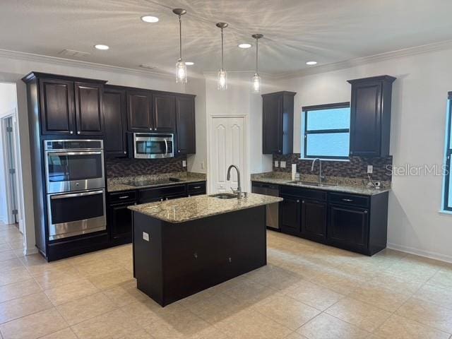 4077 River Bank Way, Punta Gorda, FL 33980 - kitchen with appliances with stainless steel finishes, a sink, light stone counters, decorative backsplash, and crown molding
