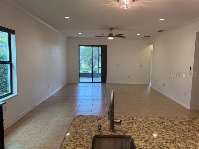 4077 River Bank Way, Punta Gorda, FL 33980 - empty room with ornamental molding, a ceiling fan, light tile patterned floors, baseboards, and recessed lighting