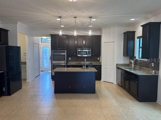 4077 River Bank Way, Punta Gorda, FL 33980 - kitchen with appliances with stainless steel finishes, a sink, light stone countertops, backsplash, and light tile patterned floors
