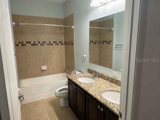 4077 River Bank Way, Punta Gorda, FL 33980 - full bath with  shower combination, toilet, double vanity, and tile patterned flooring