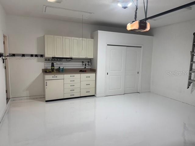 4077 River Bank Way, Punta Gorda, FL 33980 - garage featuring a garage door opener