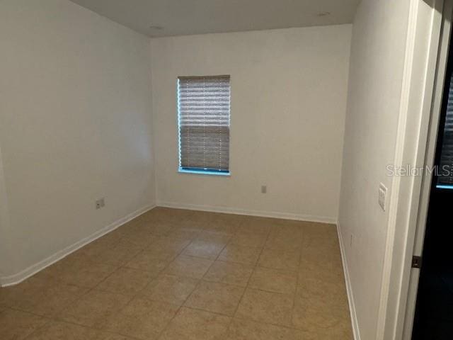4077 River Bank Way, Punta Gorda, FL 33980 - unfurnished room featuring baseboards and light tile patterned floors
