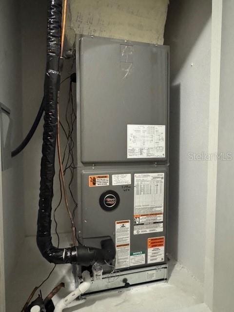 4077 River Bank Way, Punta Gorda, FL 33980 - utility room featuring heating unit