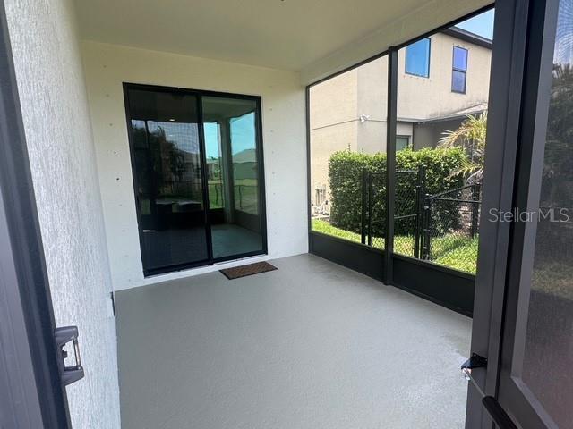 4077 River Bank Way, Punta Gorda, FL 33980 - unfurnished sunroom featuring healthy amount of natural light