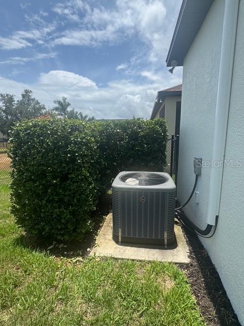 4077 River Bank Way, Punta Gorda, FL 33980 - exterior view of central AC unit and stucco siding