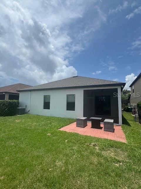 4077 River Bank Way, Punta Gorda, FL 33980 - rear view of property with a patio, a yard, and stucco siding