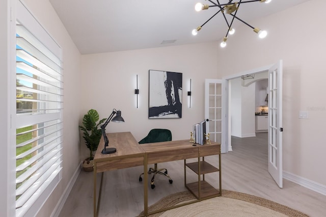 12015 Forest Park Cir, Bradenton, FL 34211 - office space featuring french doors, wood finished floors, baseboards, vaulted ceiling, and a chandelier
