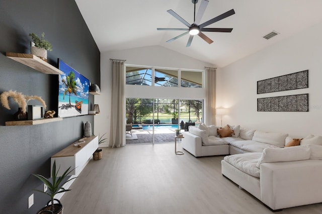 12015 Forest Park Cir, Bradenton, FL 34211 - living room with a ceiling fan, a sunroom, high vaulted ceiling, and light wood-style floors