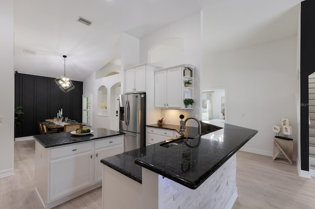 12015 Forest Park Cir, Bradenton, FL 34211 - kitchen featuring stainless steel fridge, a center island, open shelves, a sink, and light wood-type flooring