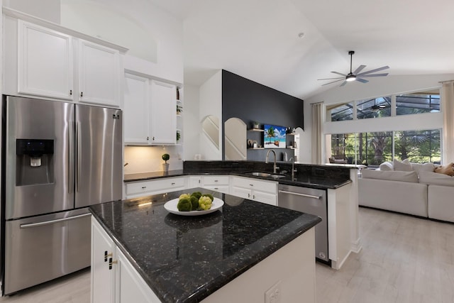 12015 Forest Park Cir, Bradenton, FL 34211 - kitchen featuring appliances with stainless steel finishes, open floor plan, a peninsula, a sink, and open shelves