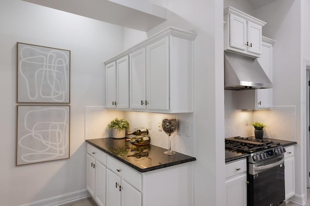 12015 Forest Park Cir, Bradenton, FL 34211 - kitchen with stainless steel range with gas stovetop, ventilation hood, decorative backsplash, and white cabinetry