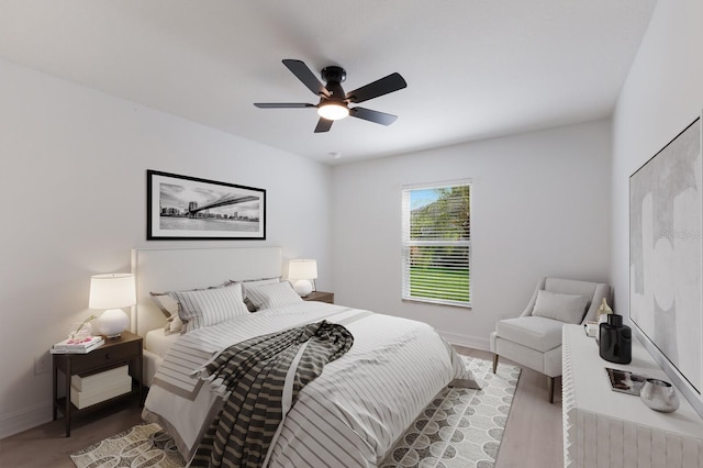 12015 Forest Park Cir, Bradenton, FL 34211 - bedroom with baseboards, ceiling fan, and wood finished floors