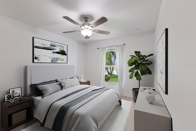 12015 Forest Park Cir, Bradenton, FL 34211 - bedroom with wood finished floors, a ceiling fan, and baseboards