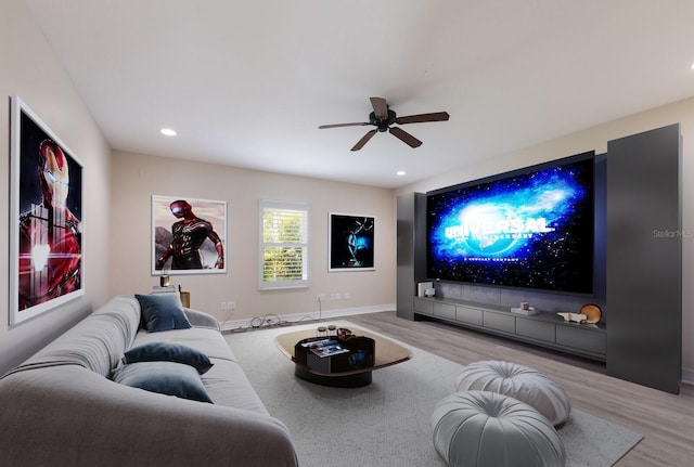 12015 Forest Park Cir, Bradenton, FL 34211 - cinema room featuring wood finished floors, a ceiling fan, recessed lighting, and baseboards