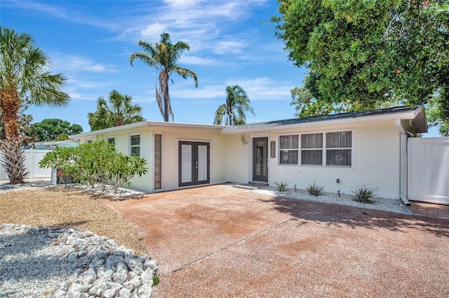 2363 Milford Cir, Sarasota, FL 34239 - single story home featuring french doors and stucco siding