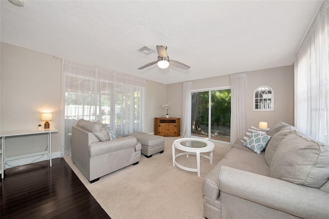 2363 Milford Cir, Sarasota, FL 34239 - living area with a ceiling fan and wood finished floors