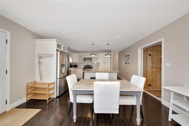 2363 Milford Cir, Sarasota, FL 34239 - dining area featuring dark wood finished floors and baseboards