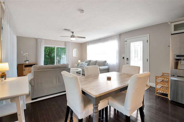 2363 Milford Cir, Sarasota, FL 34239 - dining area featuring a ceiling fan, dark wood finished floors, and baseboards