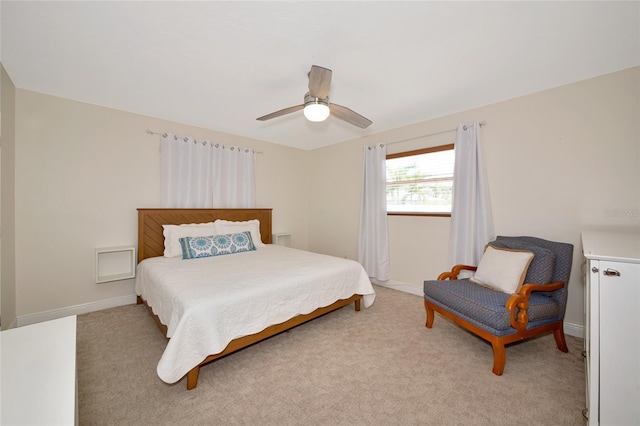 2363 Milford Cir, Sarasota, FL 34239 - bedroom with light carpet, baseboards, and a ceiling fan