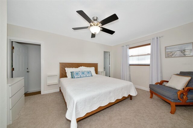 2363 Milford Cir, Sarasota, FL 34239 - bedroom featuring light carpet, baseboards, and a ceiling fan