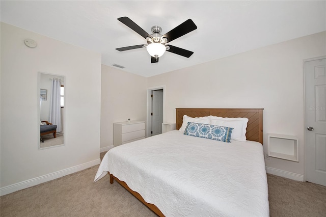 2363 Milford Cir, Sarasota, FL 34239 - bedroom with light colored carpet, baseboards, and a ceiling fan