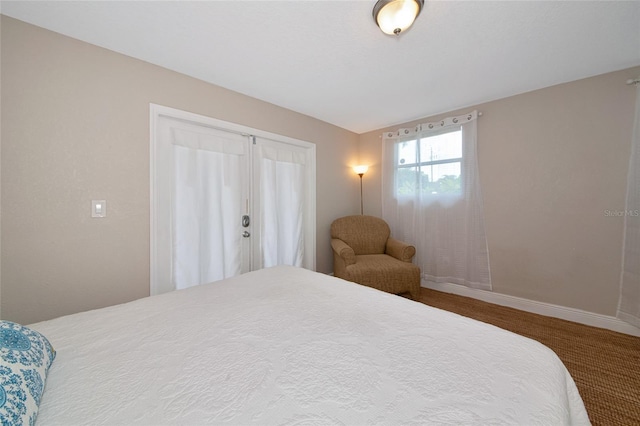 2363 Milford Cir, Sarasota, FL 34239 - bedroom with baseboards and a closet