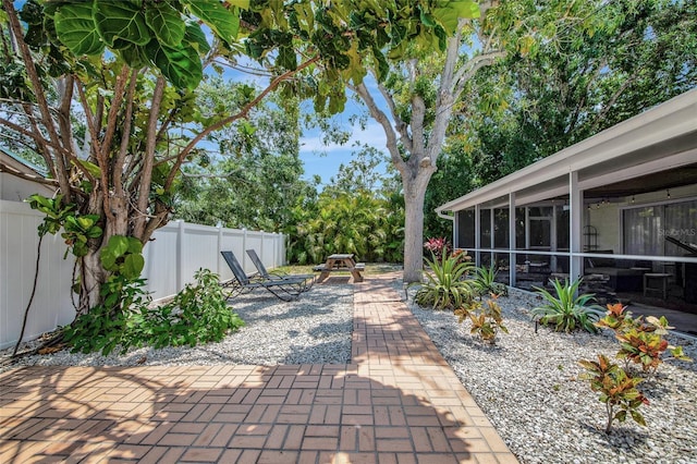 2363 Milford Cir, Sarasota, FL 34239 - fenced backyard featuring a patio area and a sunroom