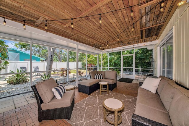 2363 Milford Cir, Sarasota, FL 34239 - sunroom featuring an outdoor hangout area and track lighting