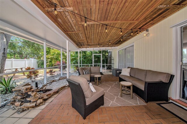 2363 Milford Cir, Sarasota, FL 34239 - sunroom with an outdoor hangout area, rail lighting, healthy amount of natural light, and a ceiling fan