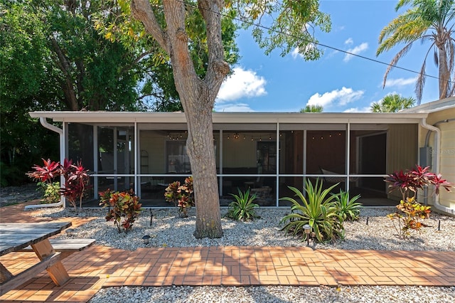 2363 Milford Cir, Sarasota, FL 34239 - back of property with a sunroom