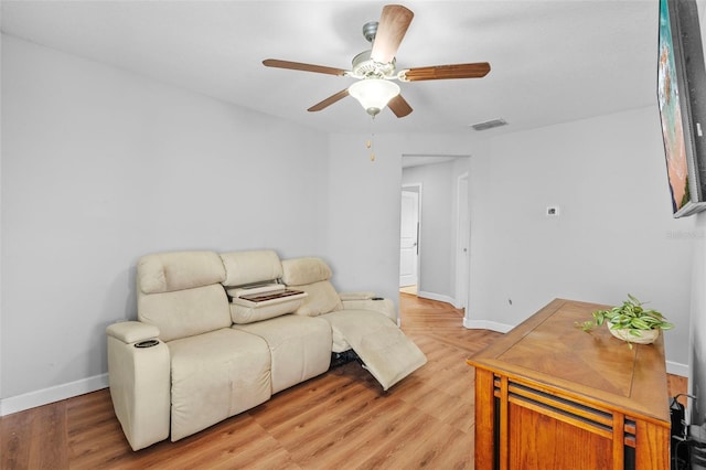 1234 Harbour Blue St, Ruskin, FL 33570 - living area with ceiling fan, baseboards, and light wood-style floors