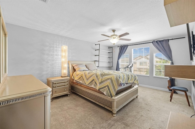 1234 Harbour Blue St, Ruskin, FL 33570 - bedroom with light carpet, a textured ceiling, baseboards, and ceiling fan
