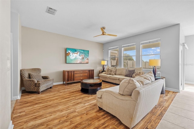 1234 Harbour Blue St, Ruskin, FL 33570 - living area with light wood finished floors, baseboards, and a ceiling fan