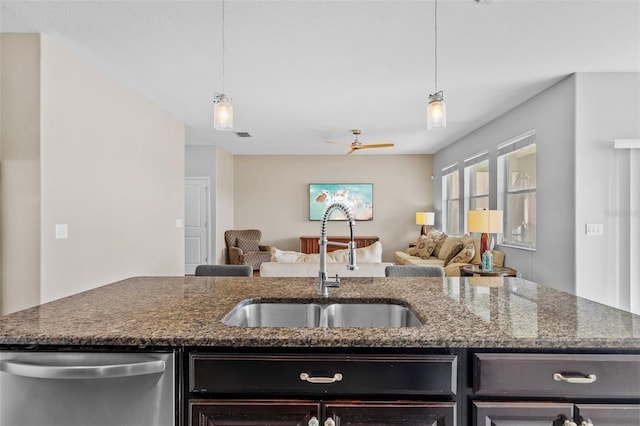 1234 Harbour Blue St, Ruskin, FL 33570 - kitchen with dishwasher, a sink, open floor plan, ceiling fan, and dark stone counters