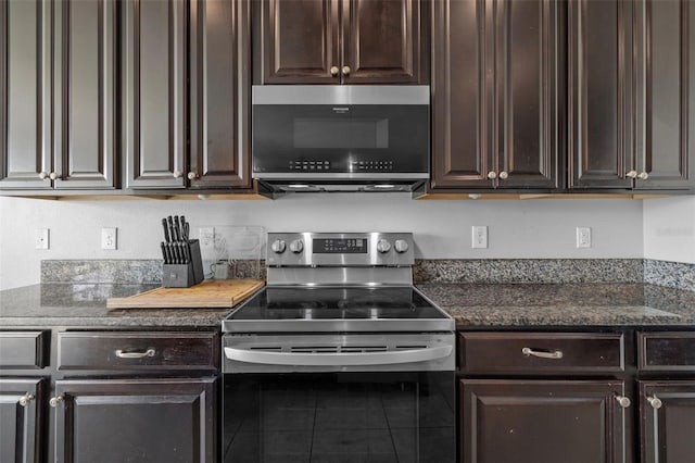1234 Harbour Blue St, Ruskin, FL 33570 - kitchen with appliances with stainless steel finishes, dark brown cabinets, dark stone countertops, and tile patterned floors