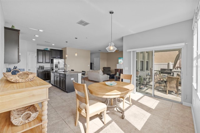 1234 Harbour Blue St, Ruskin, FL 33570 - dining area with light tile patterned floors and recessed lighting