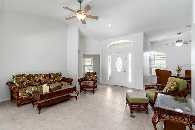 2199 Palm Ct, North Port, FL 34287 - entryway featuring a ceiling fan, light tile patterned floors, high vaulted ceiling, and baseboards